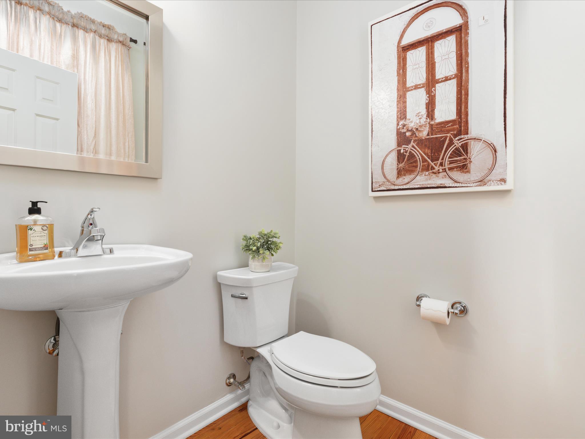 772 3rd Street Herndon, VA 20170 - Photo 15 of 52 a bathroom with a sink mirror and toilet