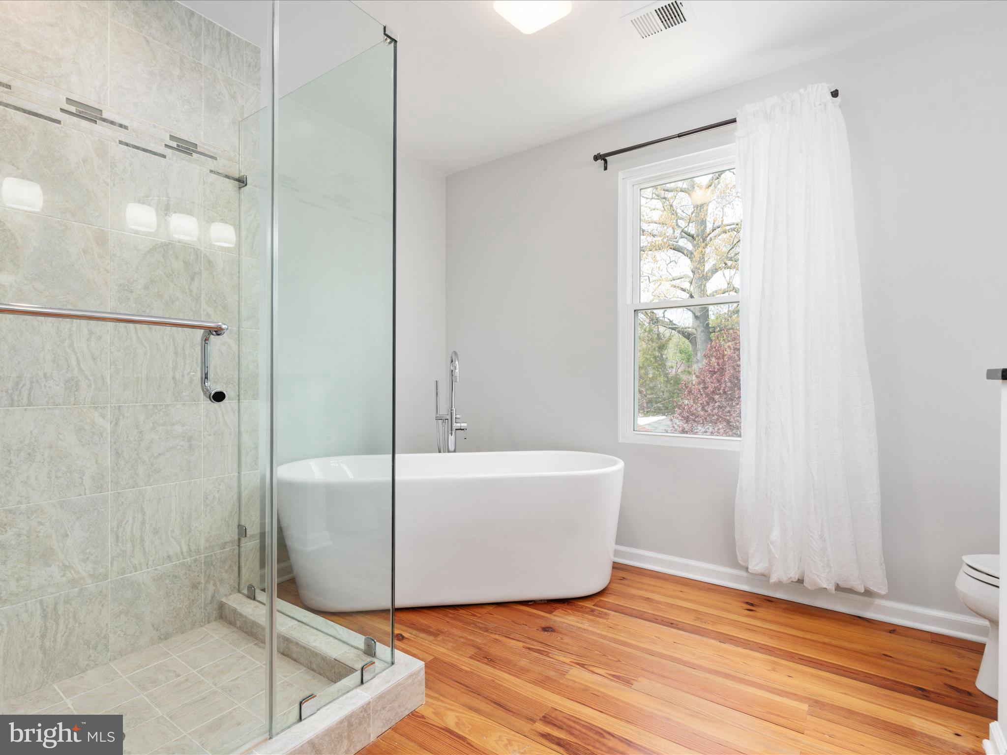 772 3rd Street Herndon, VA 20170 - Photo 20 of 52 a bathroom with a bathtub and shower