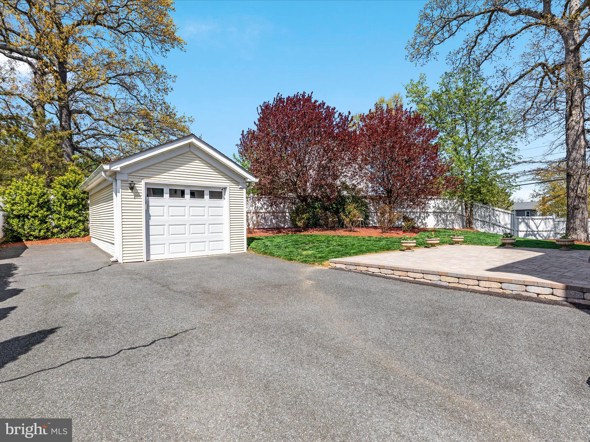 772 3rd Street Herndon, VA 20170 - Photo 2 of 52 a view of a house with a yard and large trees