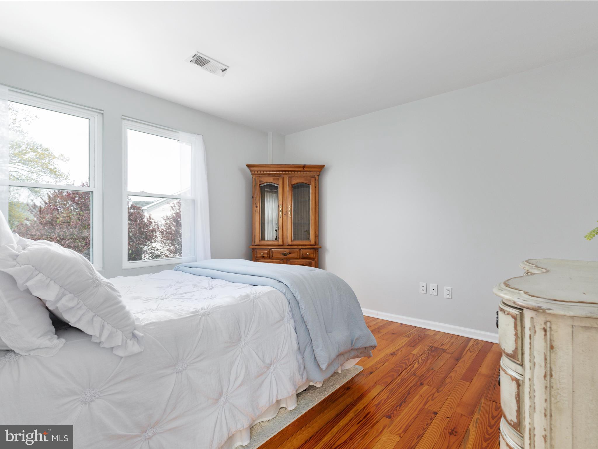 772 3rd Street Herndon, VA 20170 - Photo 22 of 52 a bedroom with a bed and a window