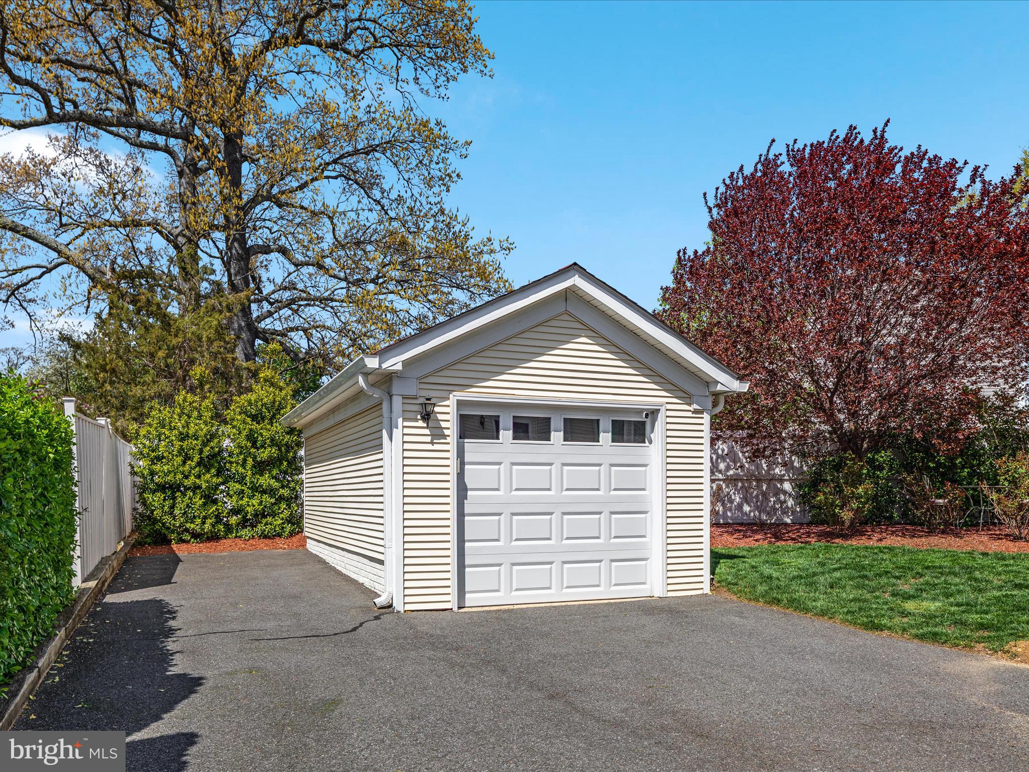 772 3rd Street Herndon, VA 20170 - Photo 35 of 52 a front view of a house with a yard and garage