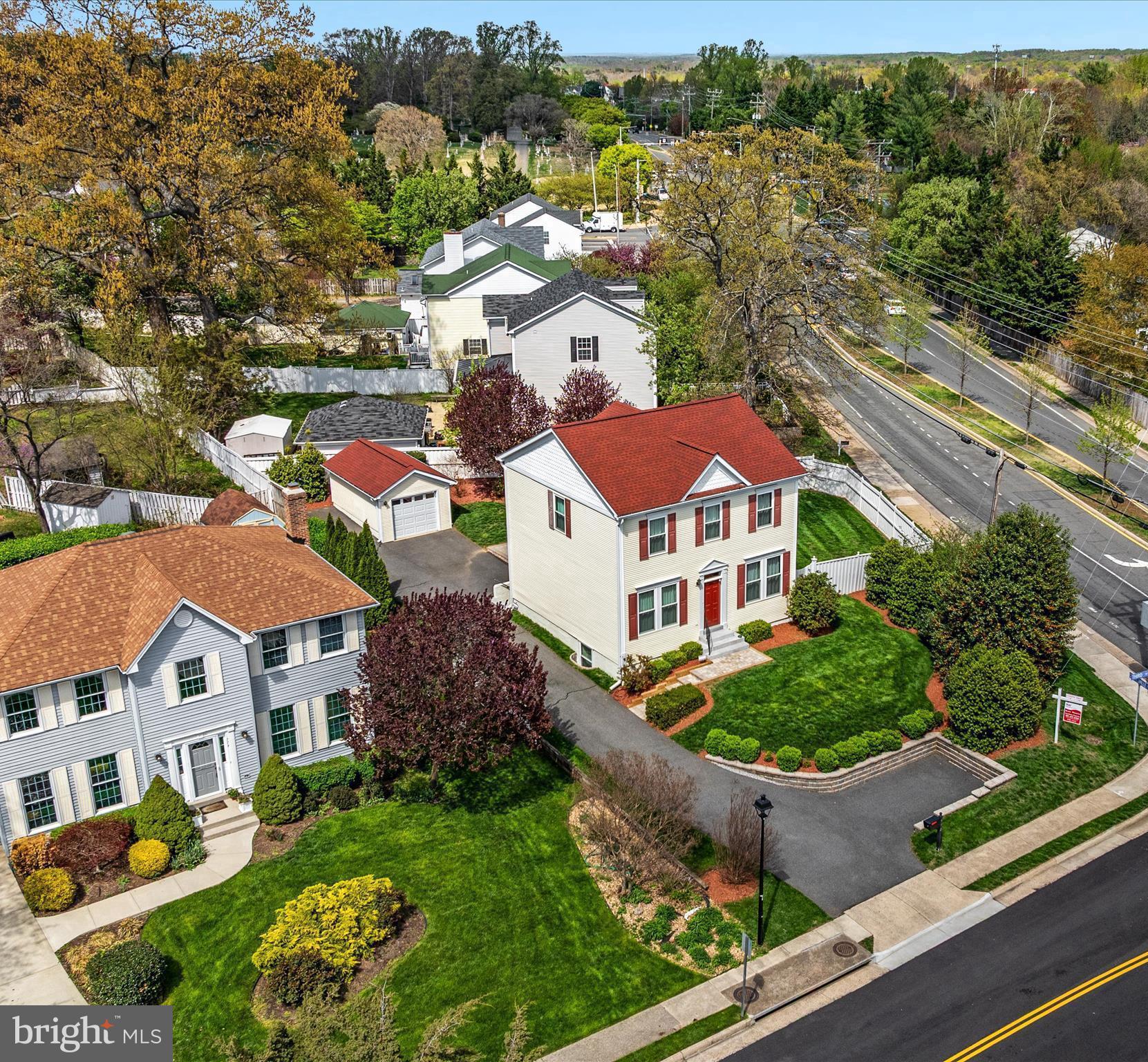 772 3rd Street Herndon, VA 20170 - Photo 38 of 52 an aerial view of multiple houses with a yard
