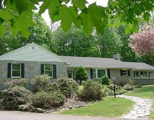 11 Lounsbury Road Ridgefield, CT 06877 - Photo 1 of 1 a front view of a house with a yard