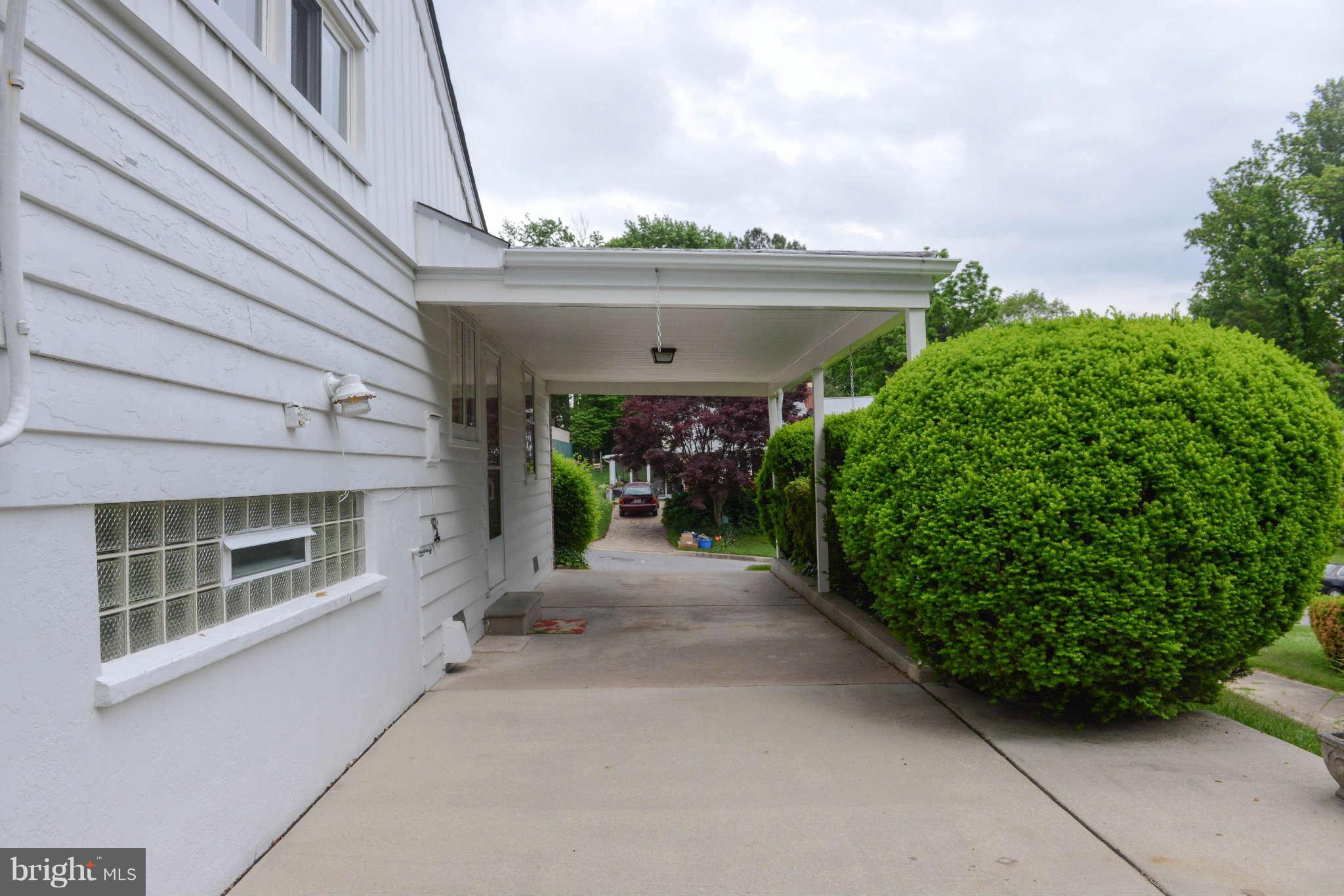 1208 St Andrews Way Baltimore, MD 21239 - Photo 16 of 20 Exterior (Rear) - Carport / Patio View