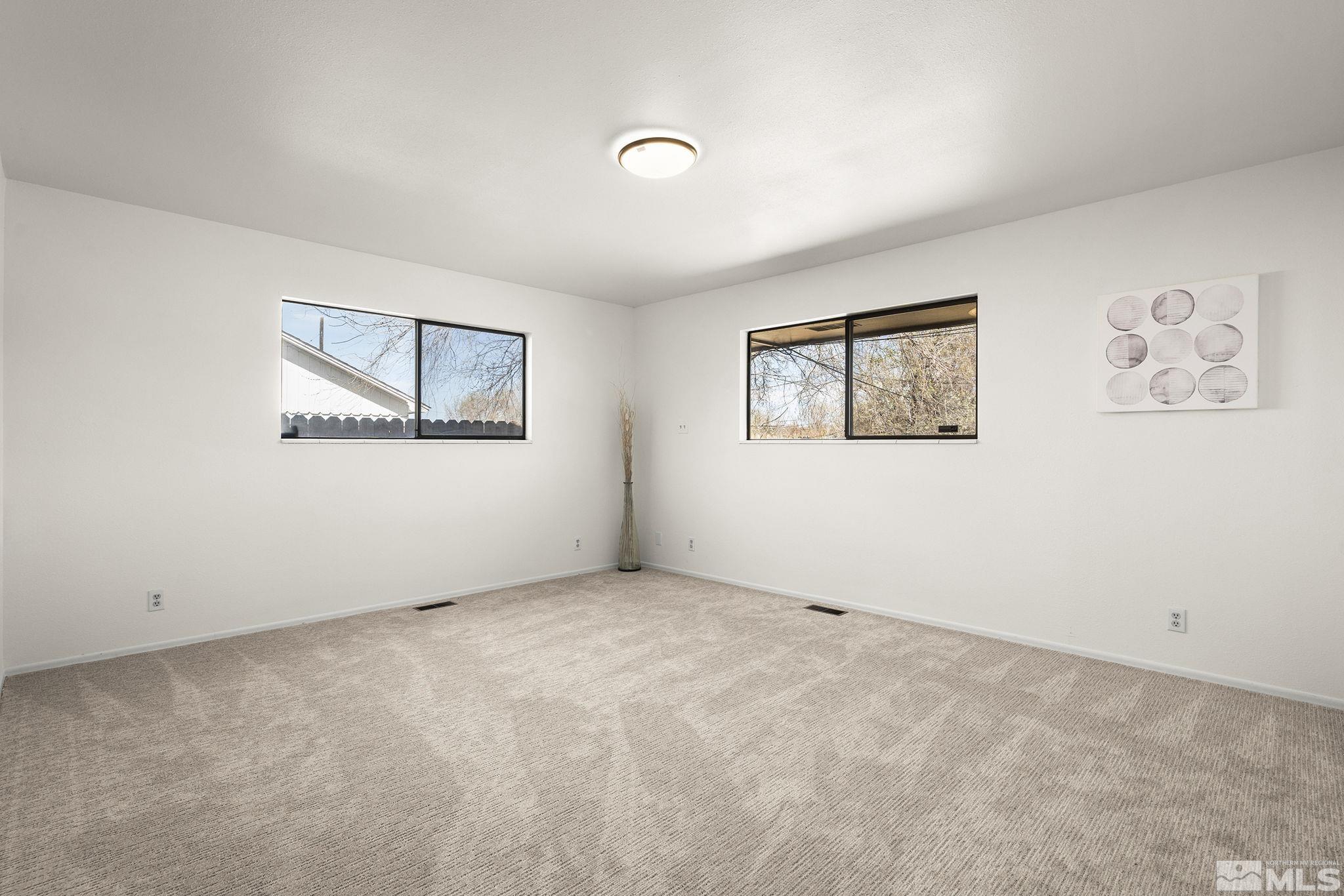 1680 Hunter Lake Drive Reno, NV 89509 - Photo 14 of 26 a view of empty room with windows