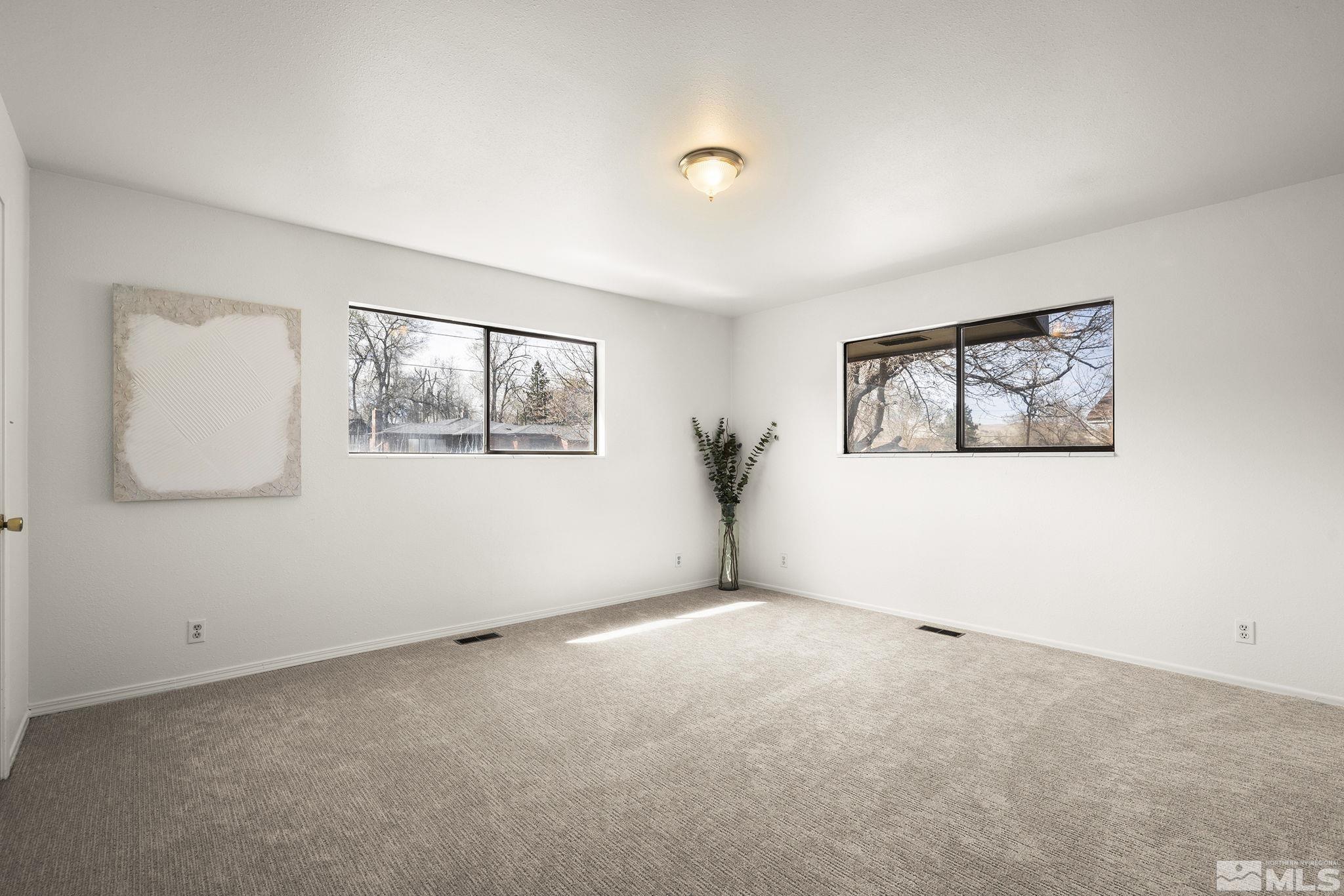 1680 Hunter Lake Drive Reno, NV 89509 - Photo 17 of 26 a view of an empty room with a window