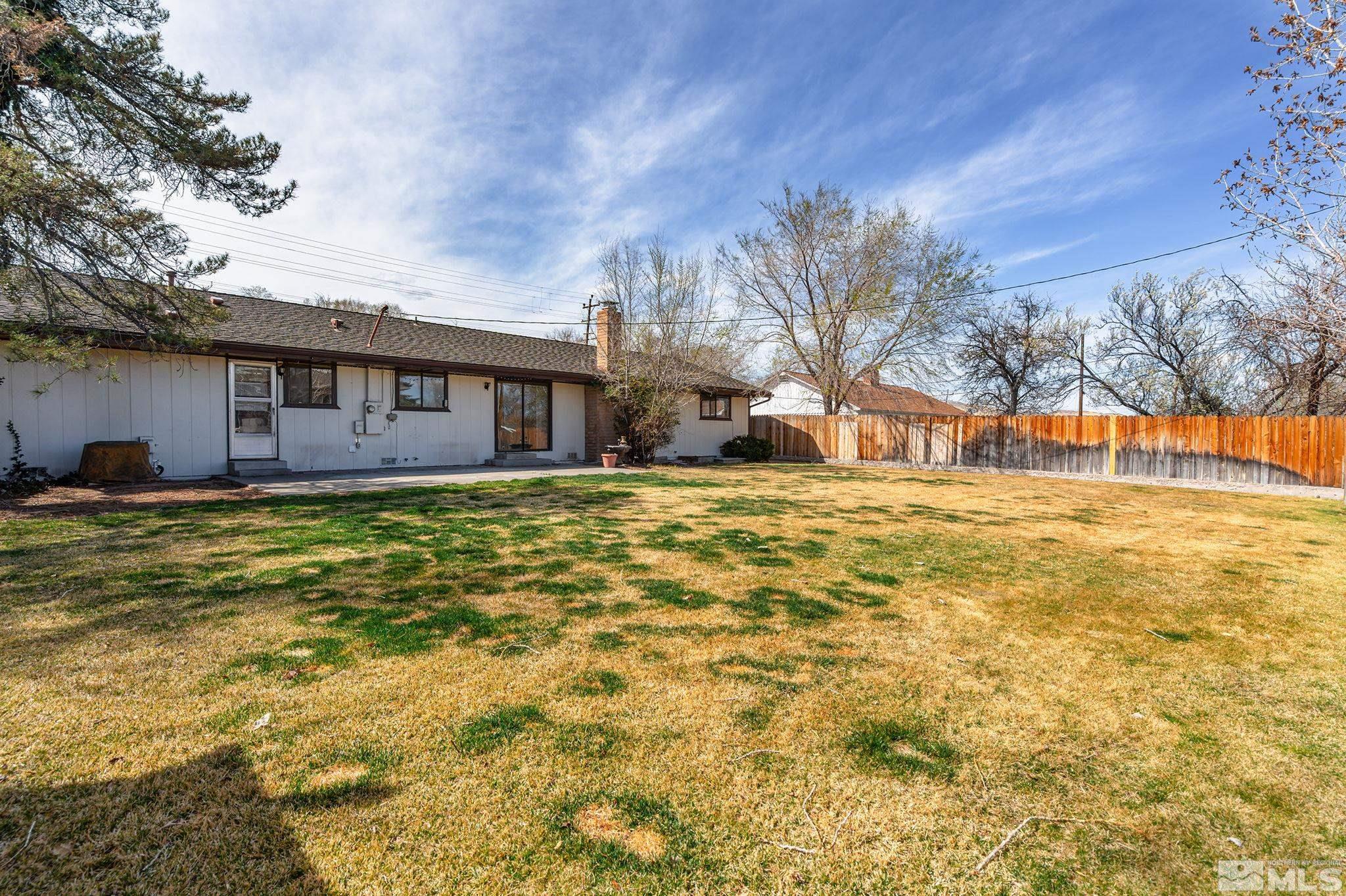 1680 Hunter Lake Drive Reno, NV 89509 - Photo 23 of 26 a view of a house with a yard