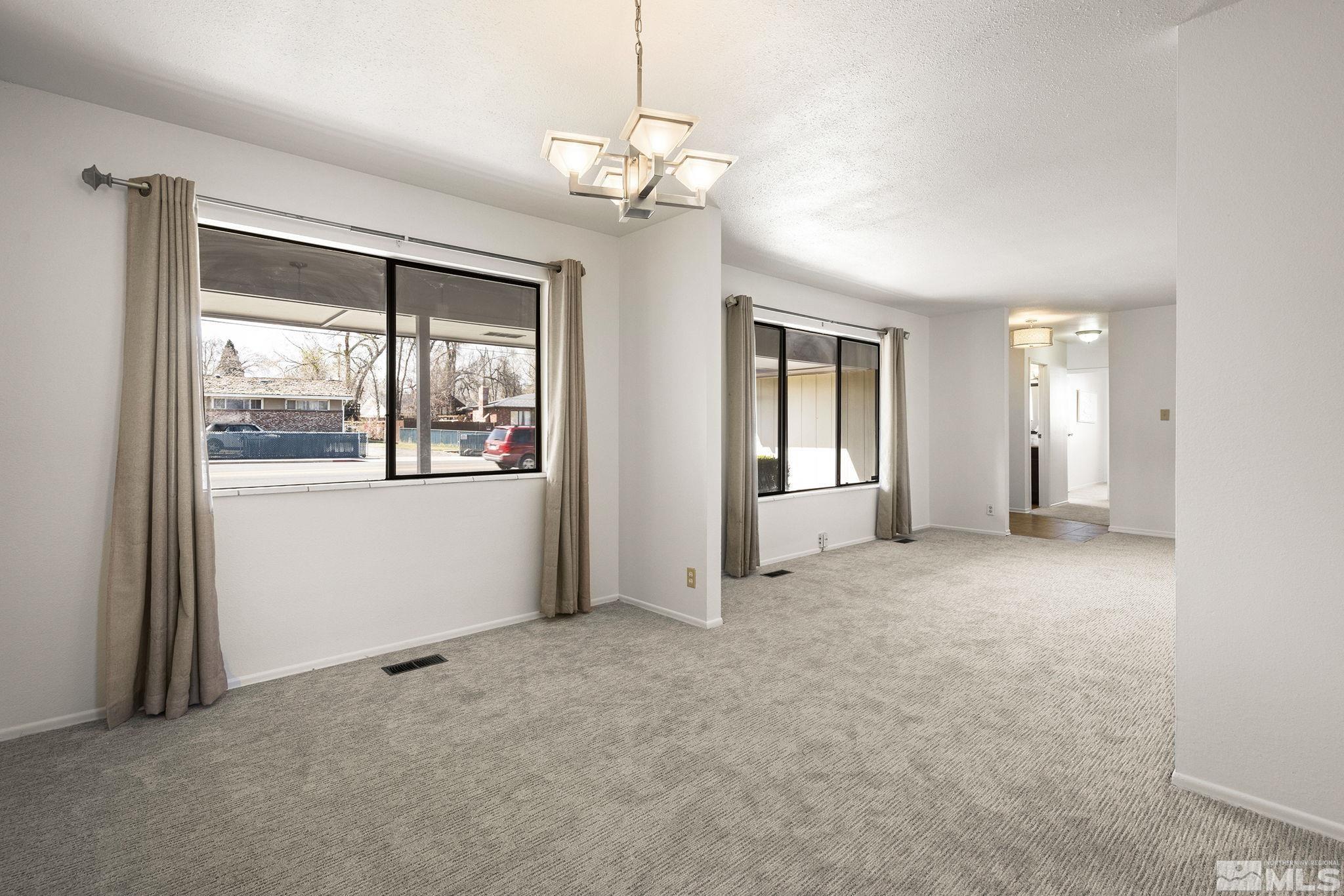 1680 Hunter Lake Drive Reno, NV 89509 - Photo 4 of 26 a view of an empty room with a window
