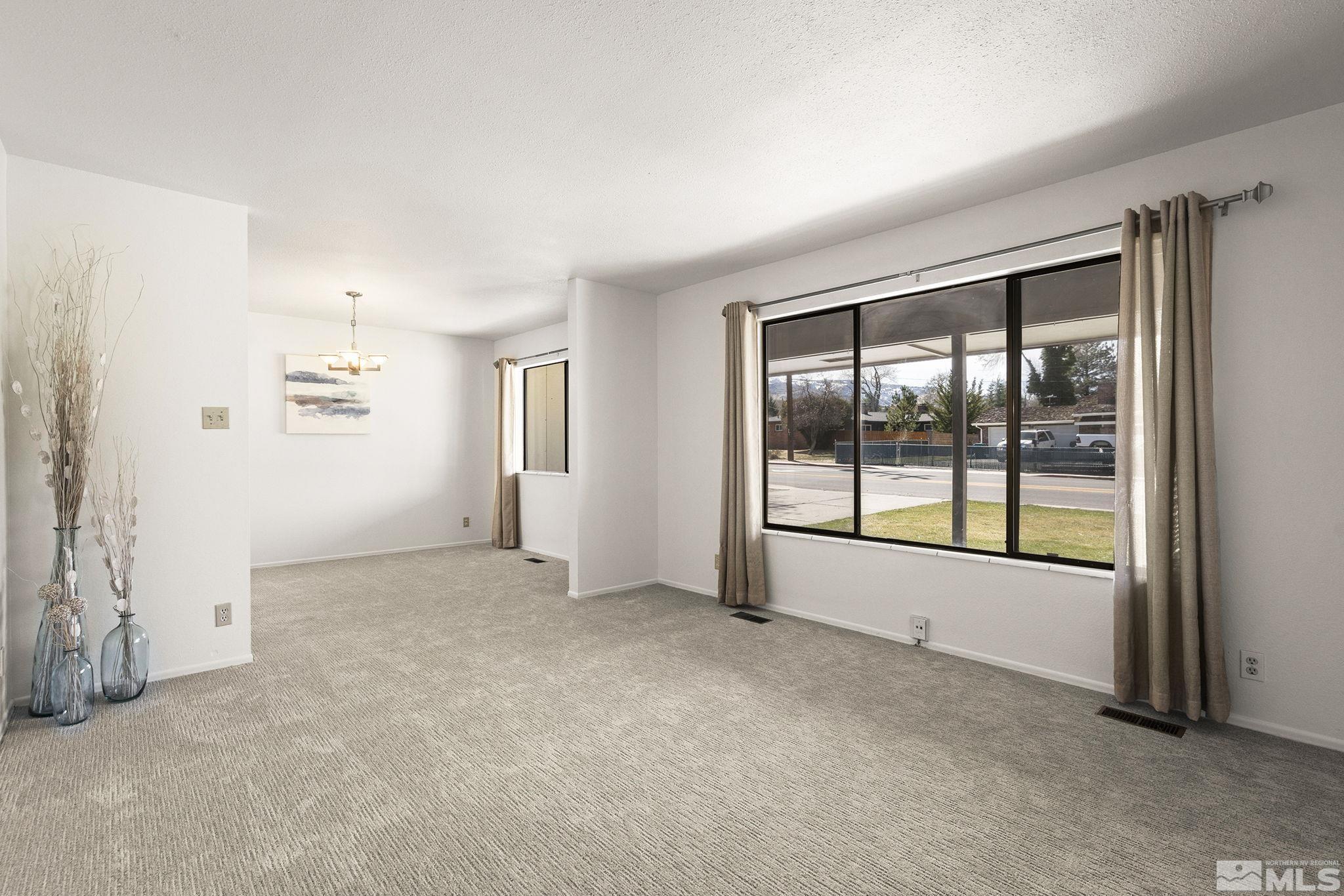 1680 Hunter Lake Drive Reno, NV 89509 - Photo 5 of 26 an empty room with windows