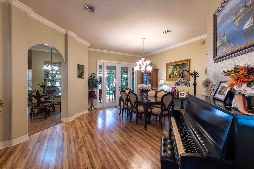 2329 South Lake Reedy Boulevard Frostproof, FL 33843 - Photo 17 of 86 a view of a dining room with furniture window and wooden floor