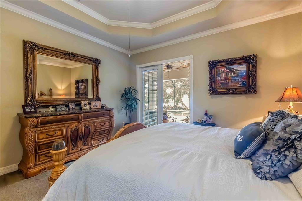 2329 South Lake Reedy Boulevard Frostproof, FL 33843 - Photo 21 of 86 a bedroom with a bed and a flat screen tv