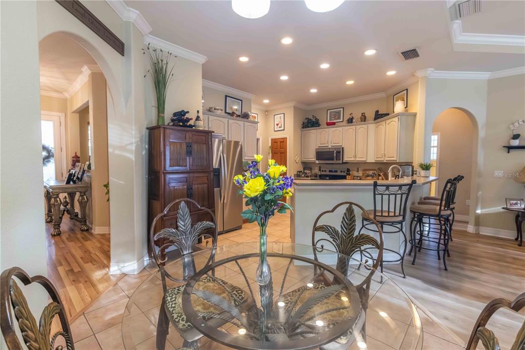 2329 South Lake Reedy Boulevard Frostproof, FL 33843 - Photo 36 of 86 a view of a dining room with furniture and a kitchen
