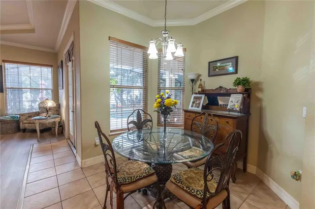 a front view of a house with a yard table and chairs