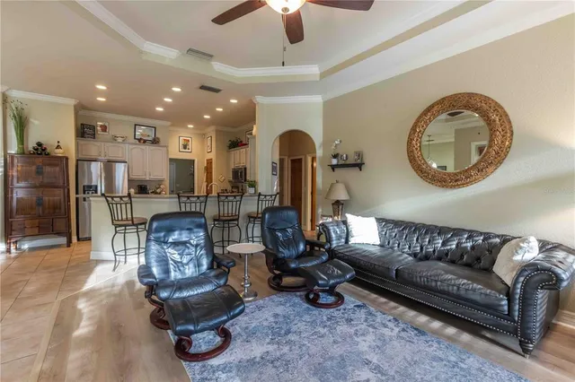 a view of a yard with plants and a fountain