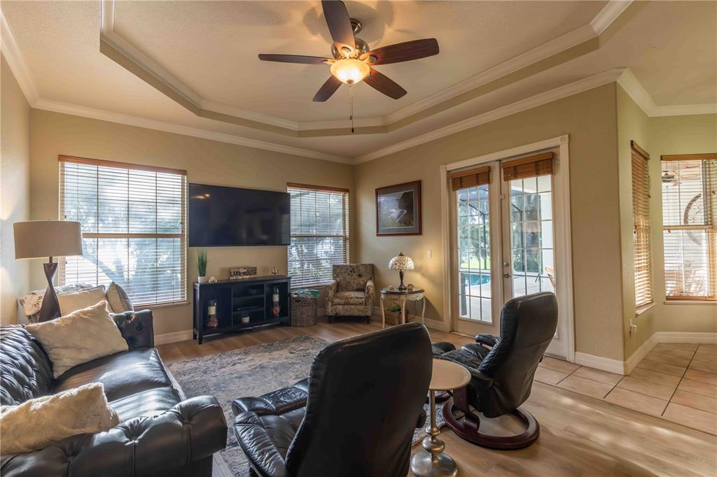 2329 South Lake Reedy Boulevard Frostproof, FL 33843 - Photo 42 of 86 a living room with furniture a fireplace and a flat screen tv