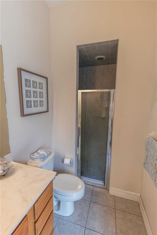 2329 South Lake Reedy Boulevard Frostproof, FL 33843 - Photo 55 of 86 a bathroom with a toilet a sink and shower