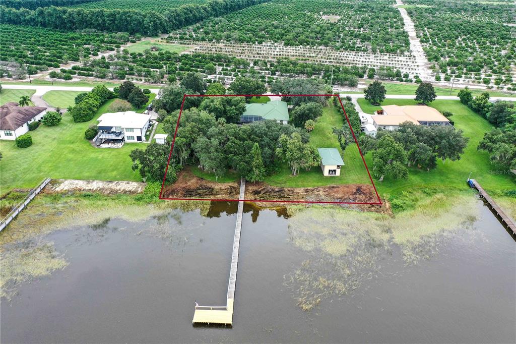 2329 South Lake Reedy Boulevard Frostproof, FL 33843 - Photo 7 of 86 an aerial view of a house with a yard and lake view
