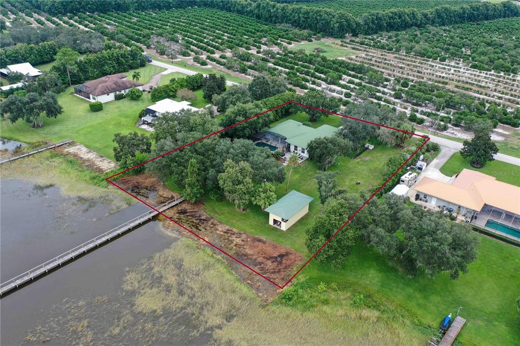 2329 South Lake Reedy Boulevard Frostproof, FL 33843 - Photo 80 of 86 an aerial view of a residential houses with outdoor space and street view