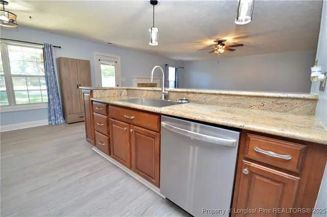 a bathroom with a granite countertop sink a large mirror and vanity