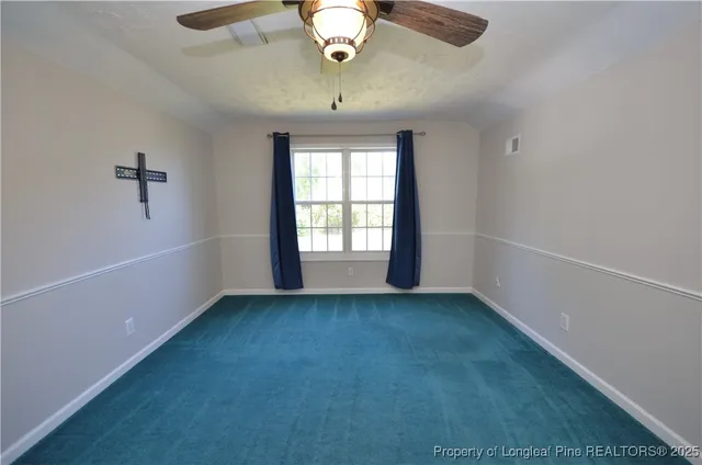 an empty room with fan