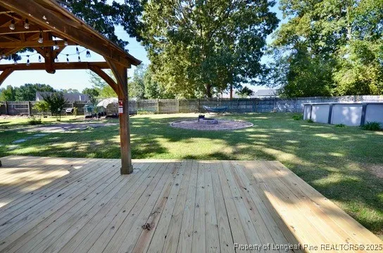 a view of a backyard with swimming pool