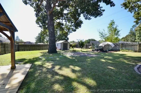 a view of a backyard with a small cabin