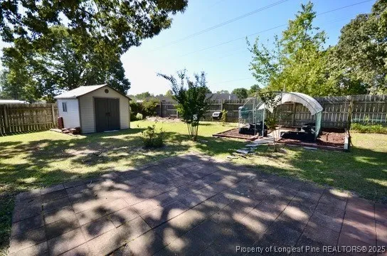 a view of a swimming pool with lawn chairs under an umbrella