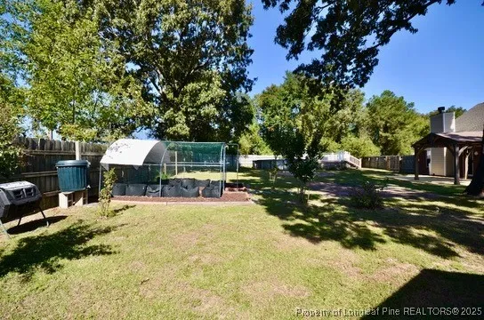 a front view of house with yard and outdoor seating