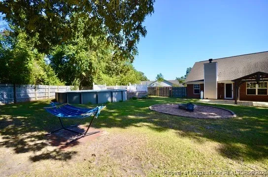 a view of a house with a back yard