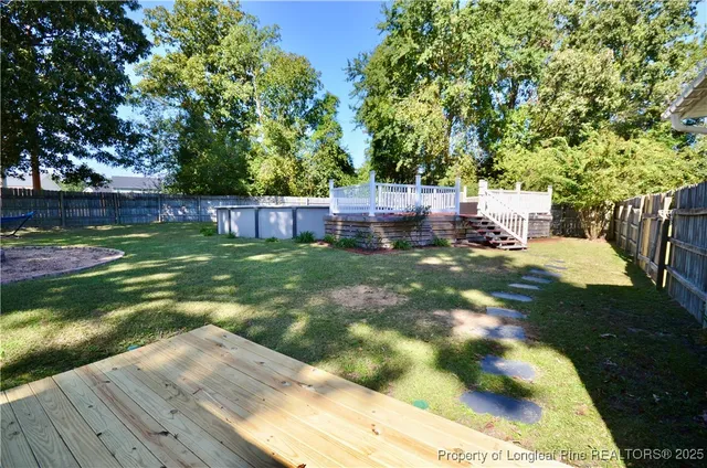 a view of a backyard with a sitting area