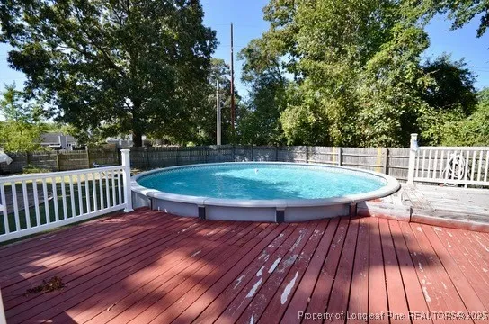 a view of a swimming pool and an outdoor seating