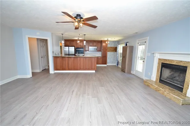 a living room with a couch and a fireplace