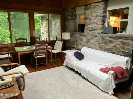 a bed room with a bed and a chair