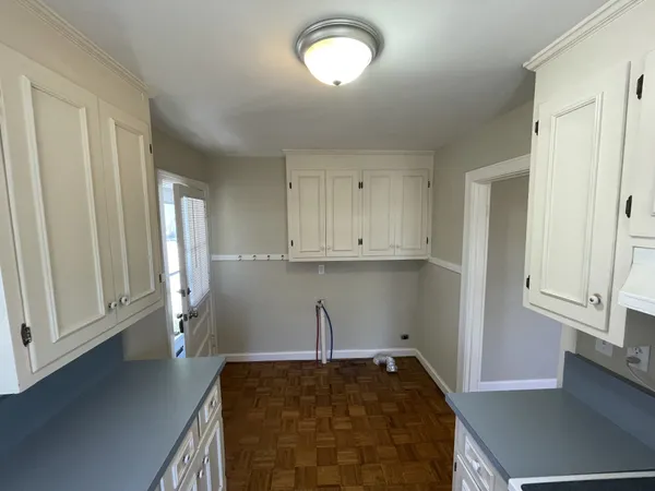 a view of a kitchen with a sink cabinets and a window