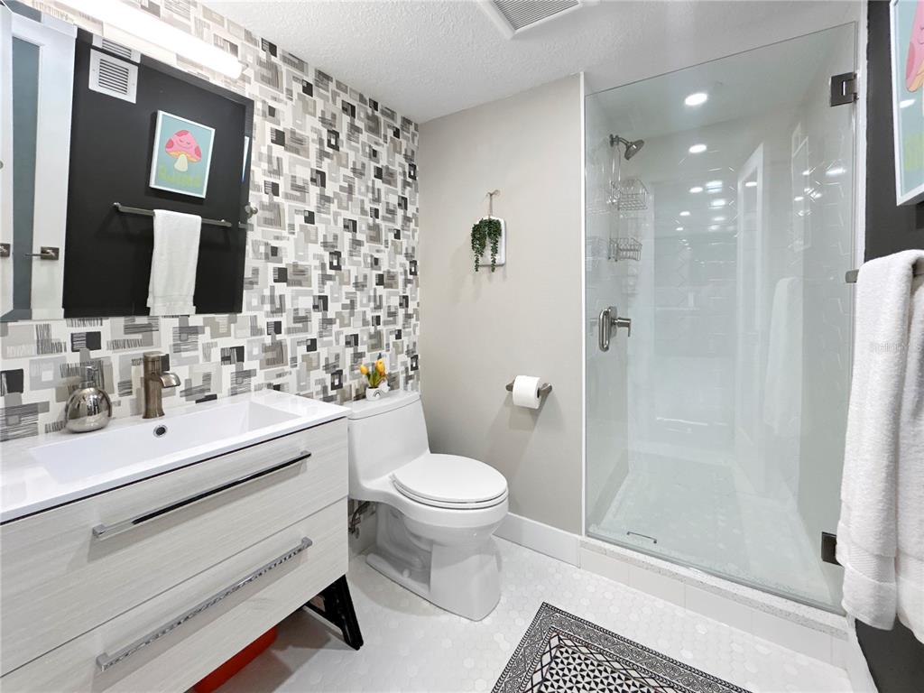 101 South Gulfstream Avenue, Unit 9C Sarasota, FL 34236 - Photo 16 of 24 a bathroom with a sink toilet and shower