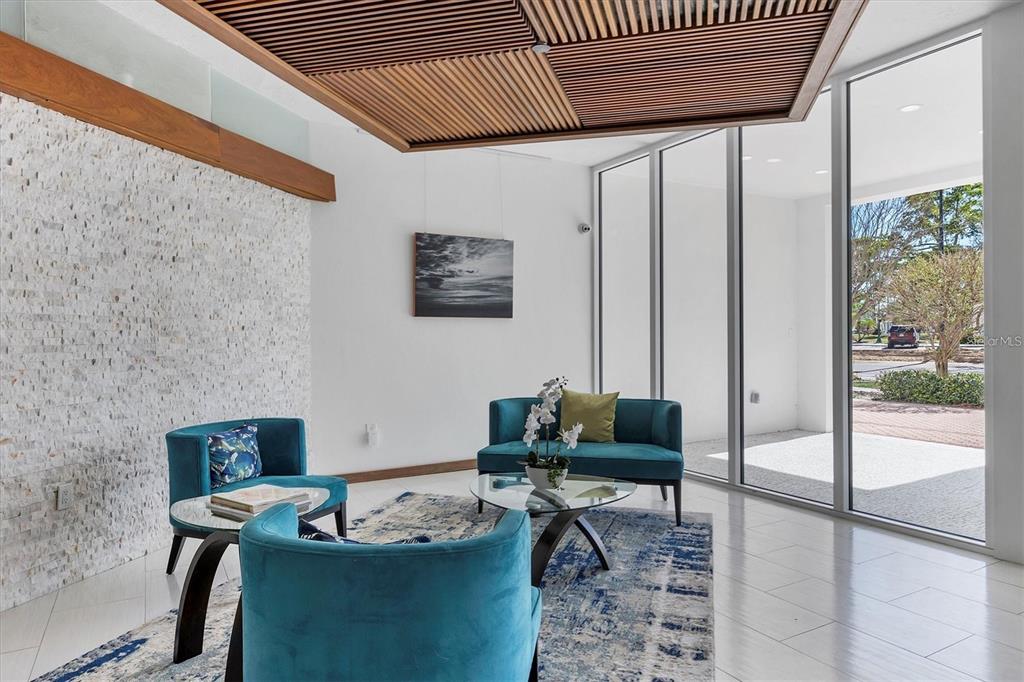 101 South Gulfstream Avenue, Unit 9C Sarasota, FL 34236 - Photo 5 of 24 a living room with furniture and a large window