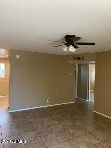 2311 West Glenrosa Avenue, Unit 1 Phoenix, AZ 85015 - Photo 7 of 12 a view of a livingroom with a ceiling fan and carpet