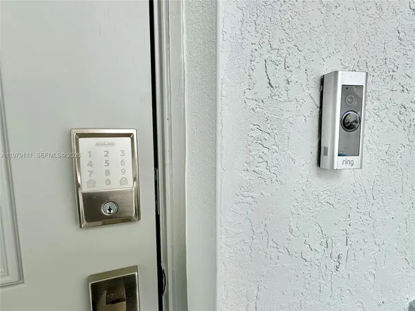 a bathroom with a shower and a sink