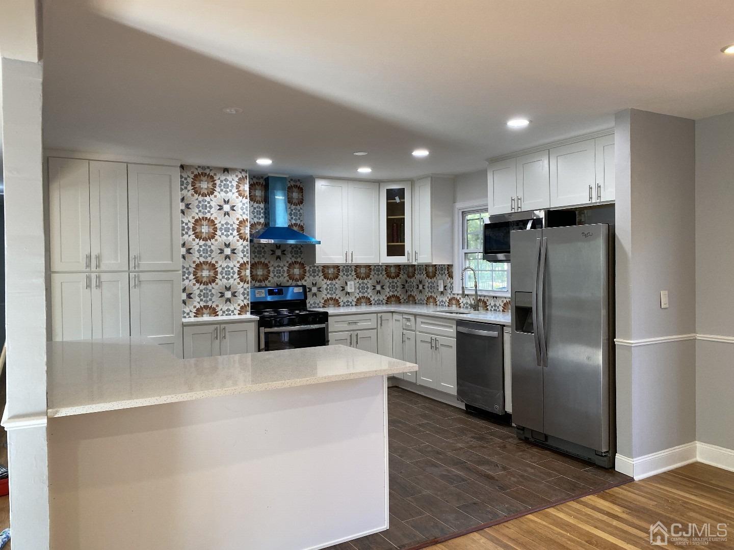 34 Hillsdale Road Edison, NJ 08820 - Photo 2 of 6 a kitchen with a refrigerator and a stove top oven