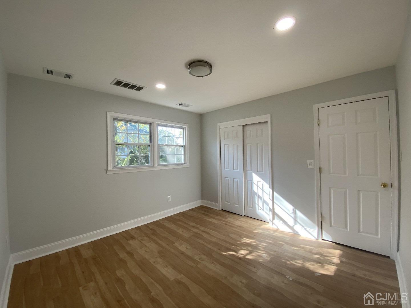 34 Hillsdale Road Edison, NJ 08820 - Photo 6 of 6 a view of an empty room with a window