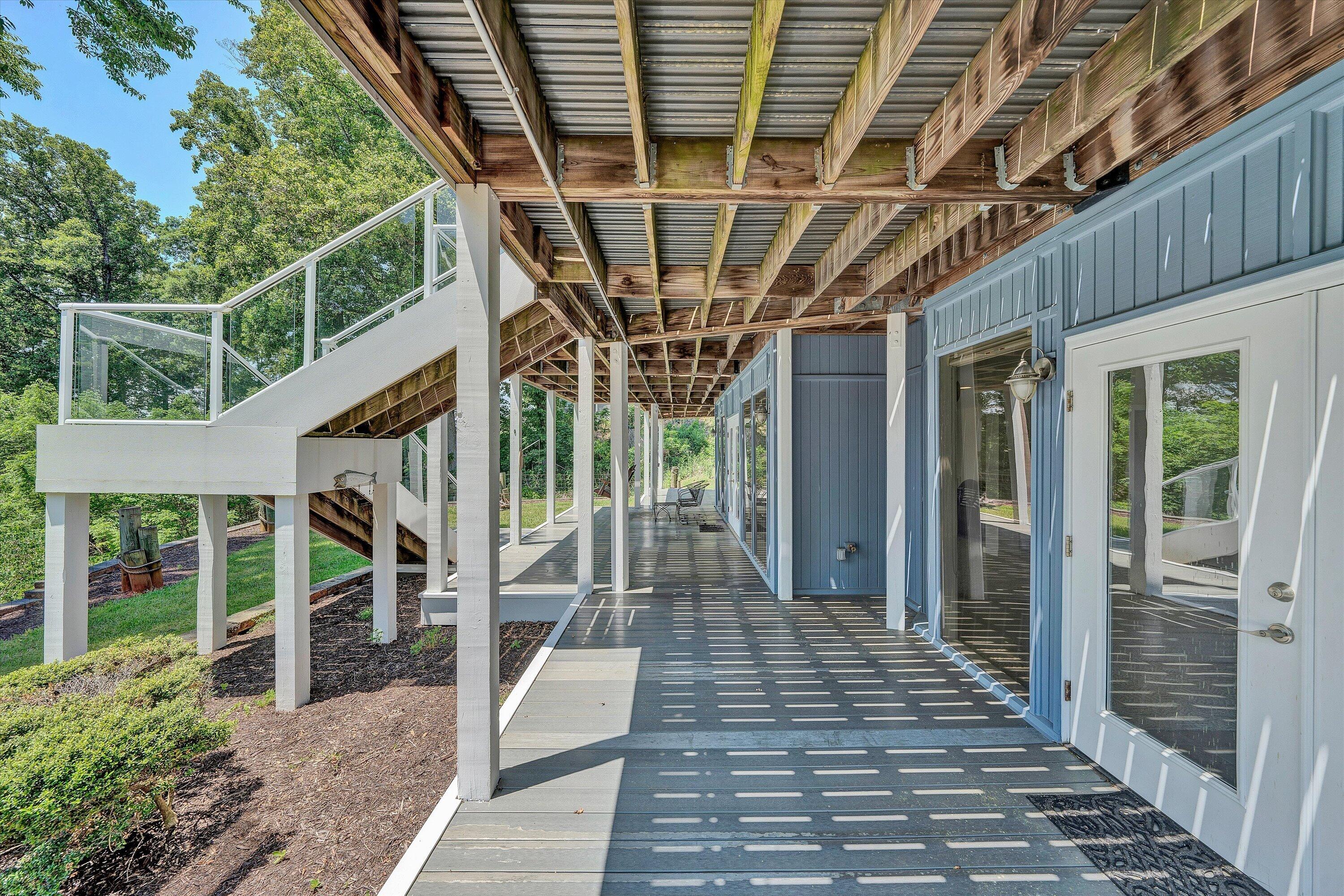 207 Winding Way Union Hall, VA 24176 - Photo 45 of 60 a view of a porch with wooden floor and iron stairs
