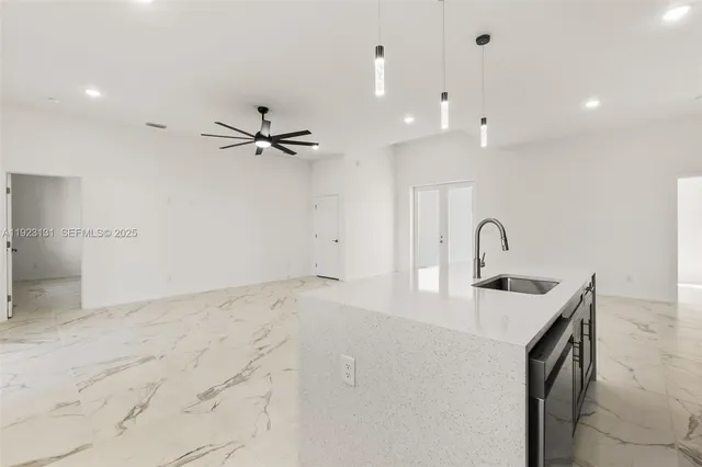 a very nice looking room with a ceiling fan