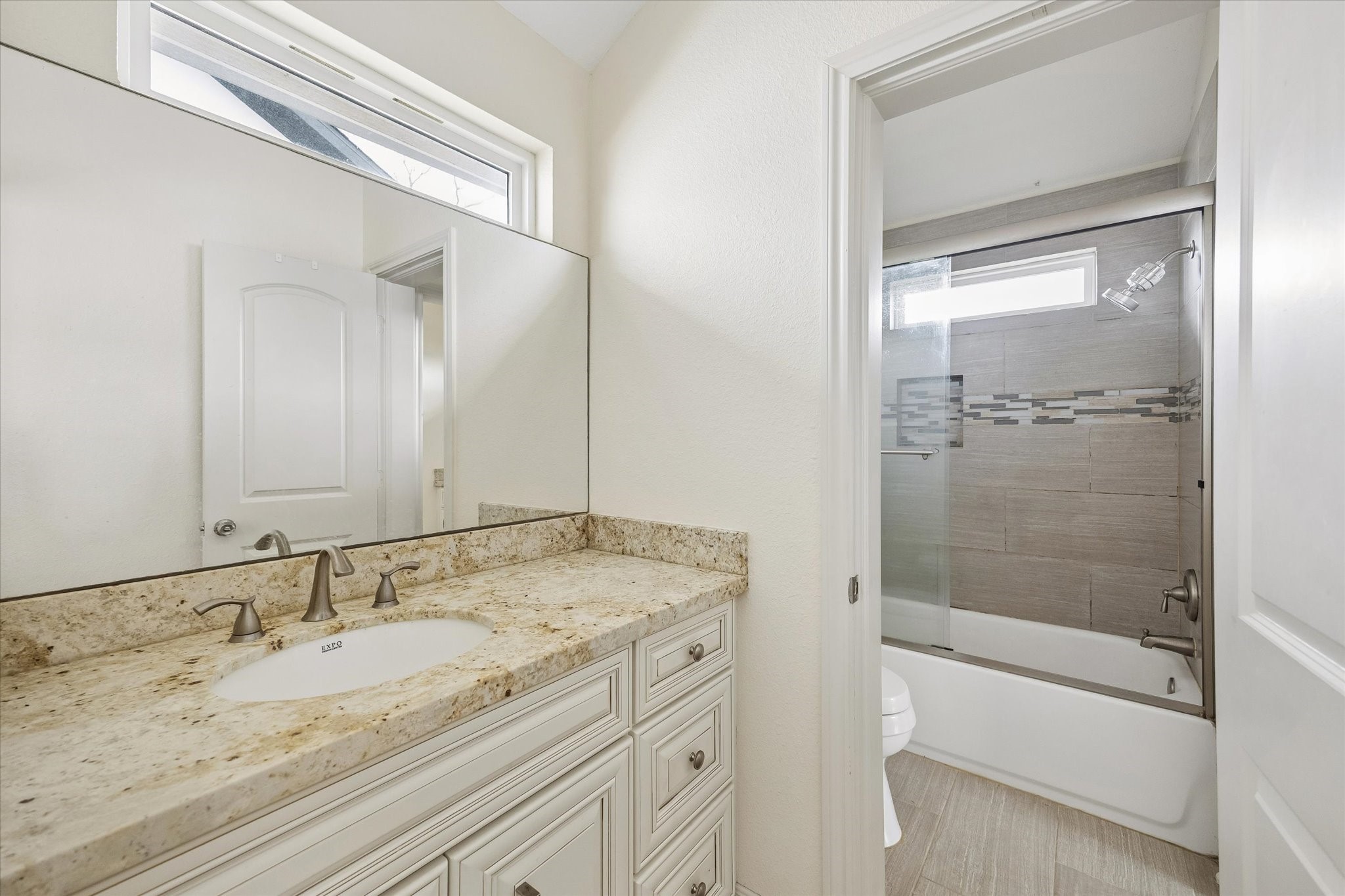 6529 Rolla Street Houston, TX 77055 - Photo 20 of 28 The Hollywood bathroom means each bedroom has their own sink and the shower area is shared.