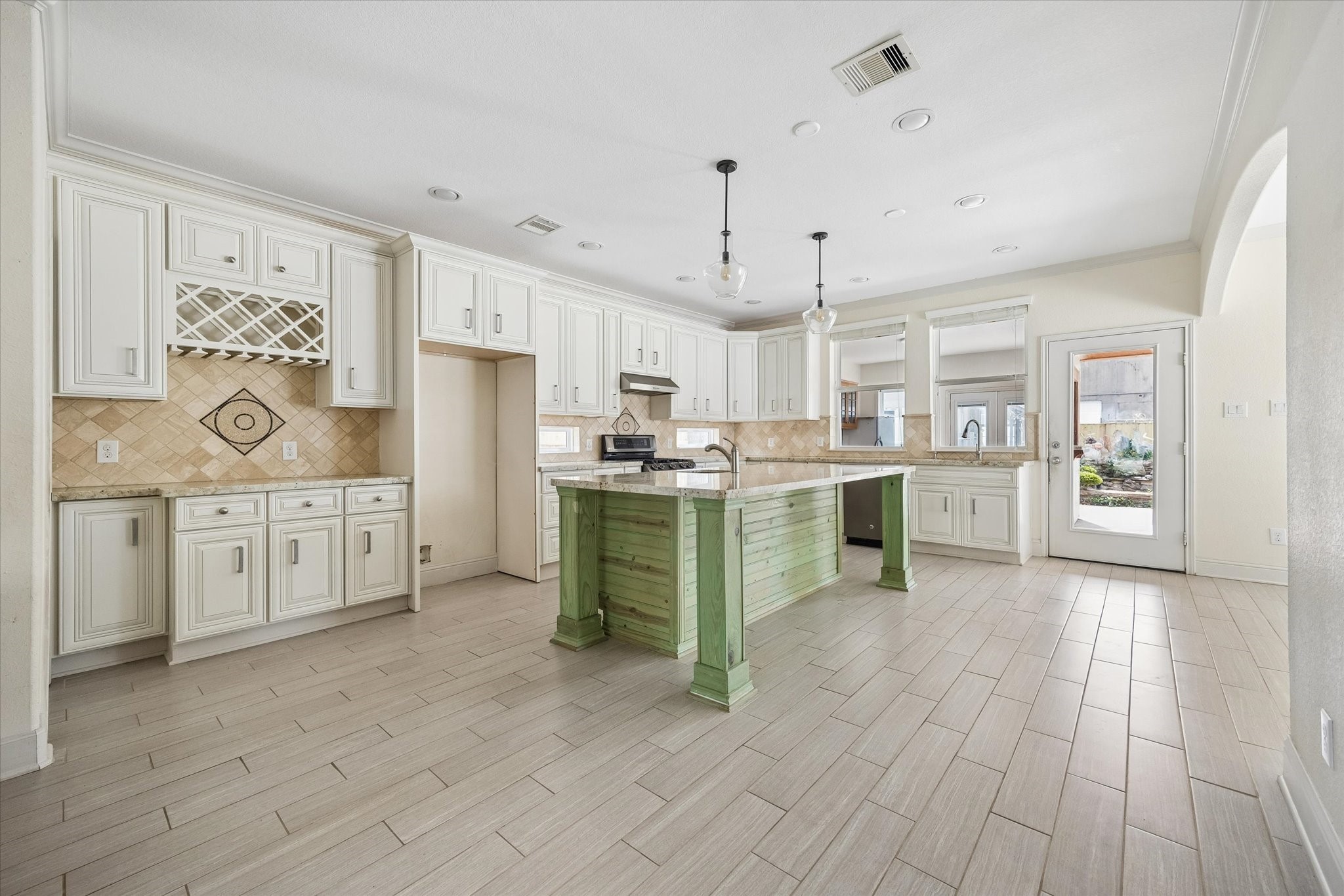 6529 Rolla Street Houston, TX 77055 - Photo 7 of 28 The home was expanded to create this beautiful kitchen with dual sinks, a walk-in pantry and so much storage!