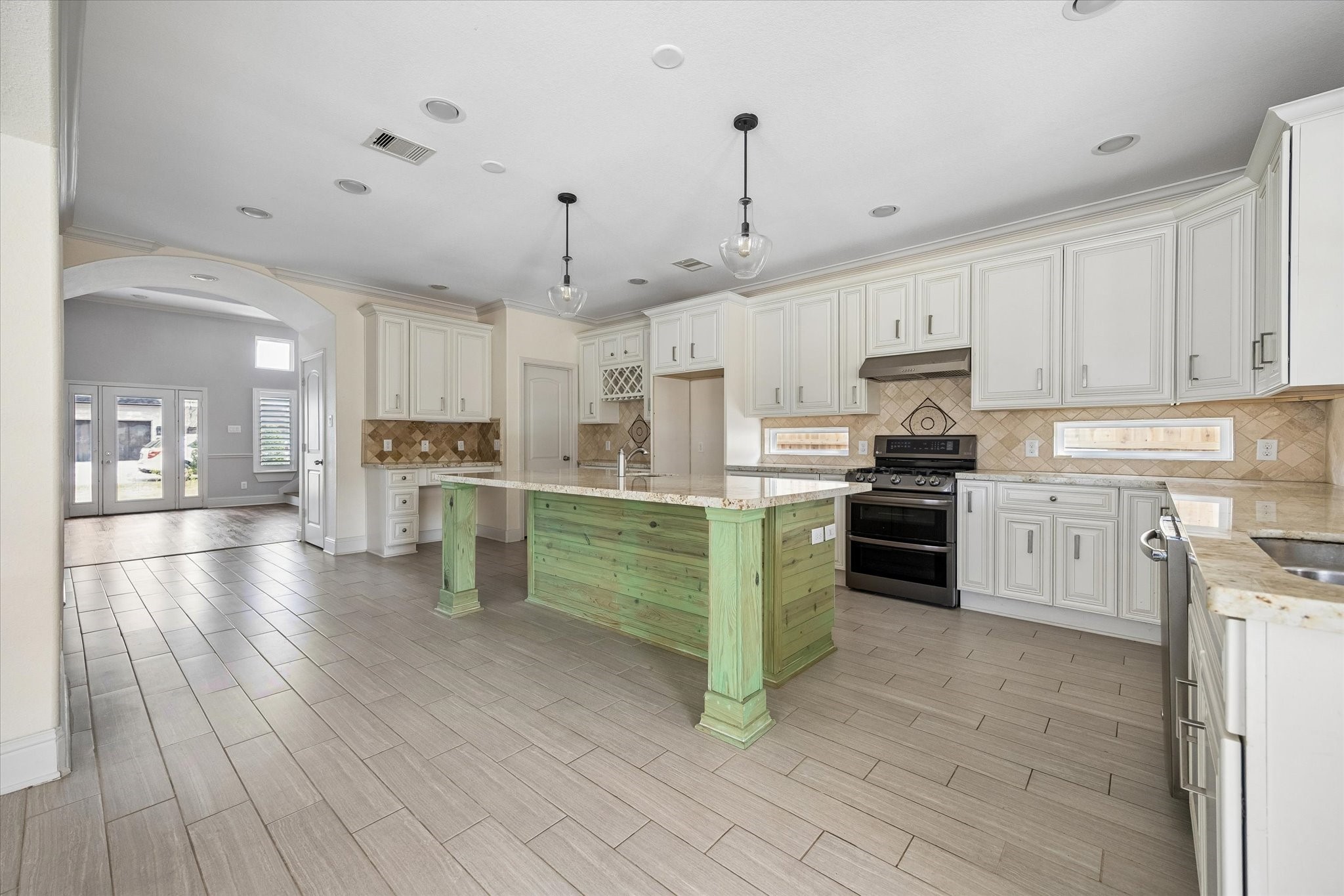 6529 Rolla Street Houston, TX 77055 - Photo 8 of 28 A view of the kitchen looking toward the living room and front door.