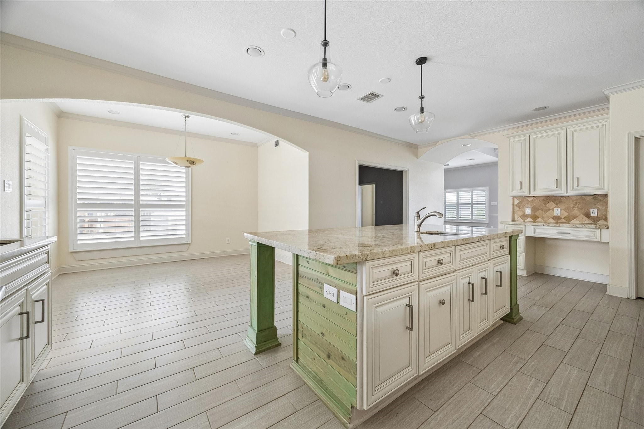 6529 Rolla Street Houston, TX 77055 - Photo 9 of 28 Another view of the kitchen overlooking the breakfast room and a formal dining between that and the living room.