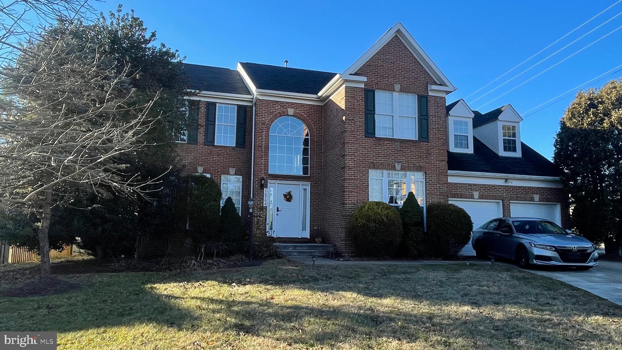 14764 Courtlandt Heights Road Woodbridge, VA 22193 - Photo 1 of 17 a front view of a house with a yard