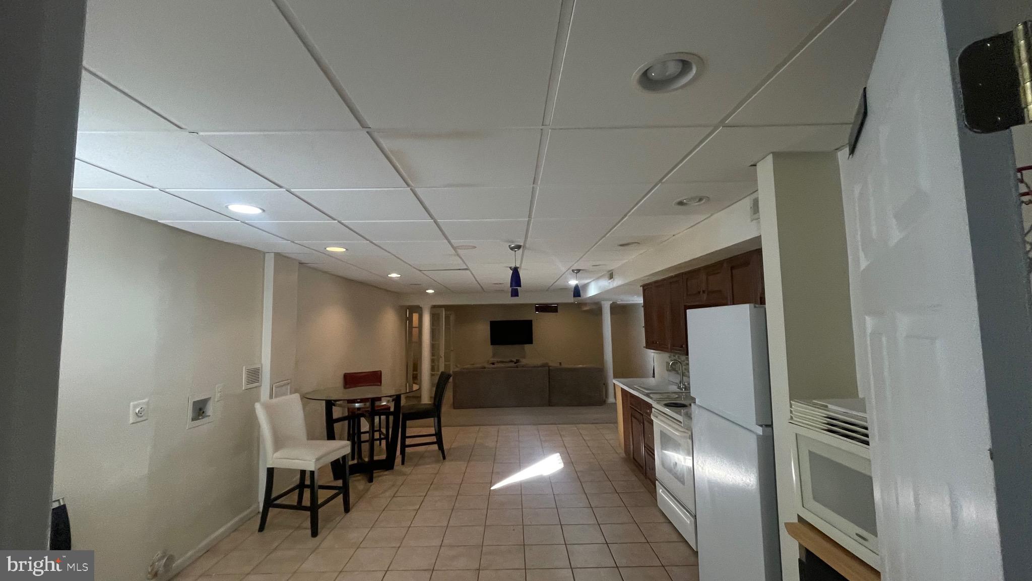 14764 Courtlandt Heights Road Woodbridge, VA 22193 - Photo 13 of 17 a room with furniture and a kitchen