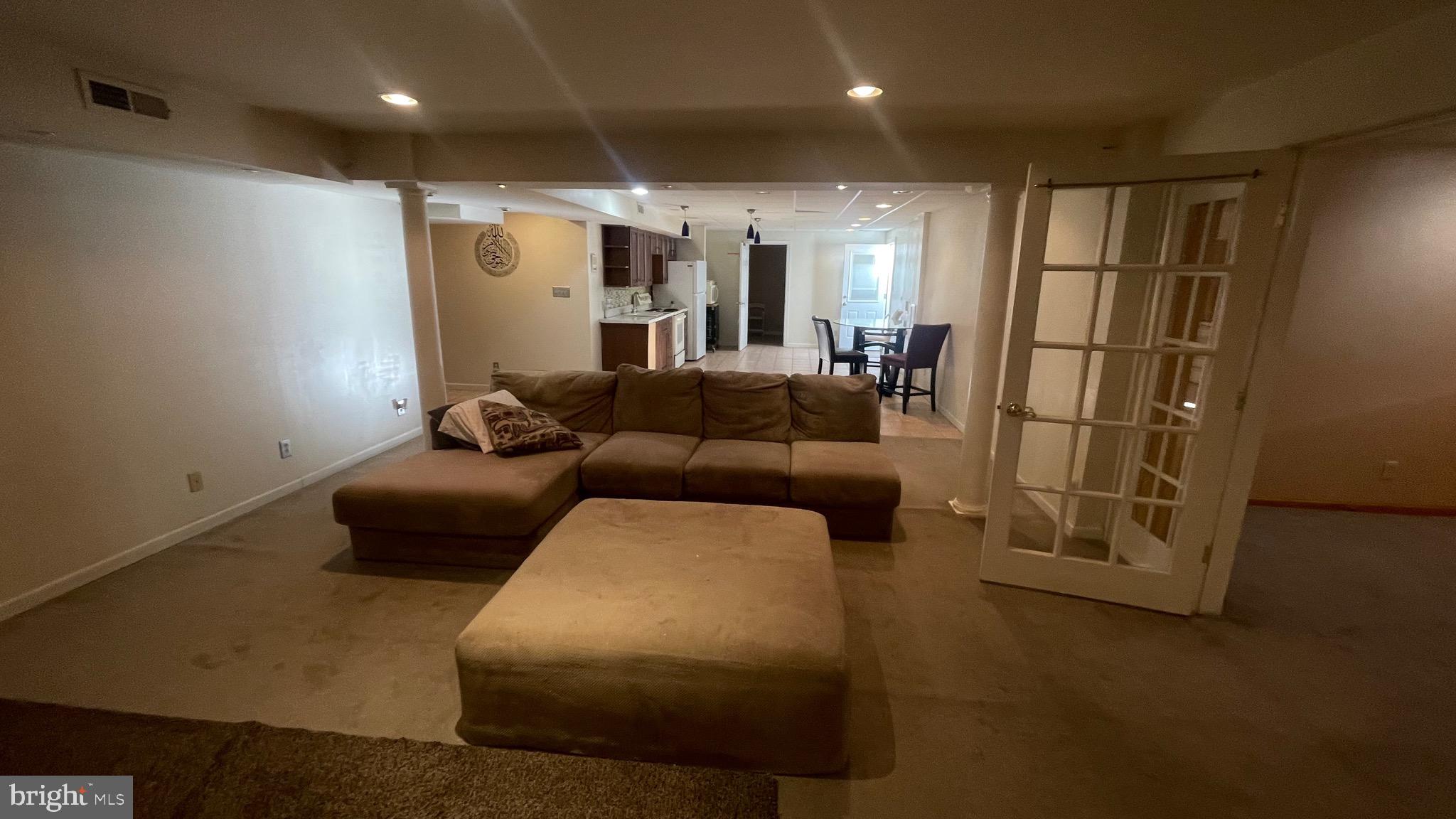 14764 Courtlandt Heights Road Woodbridge, VA 22193 - Photo 15 of 17 a living room with furniture and a glass door