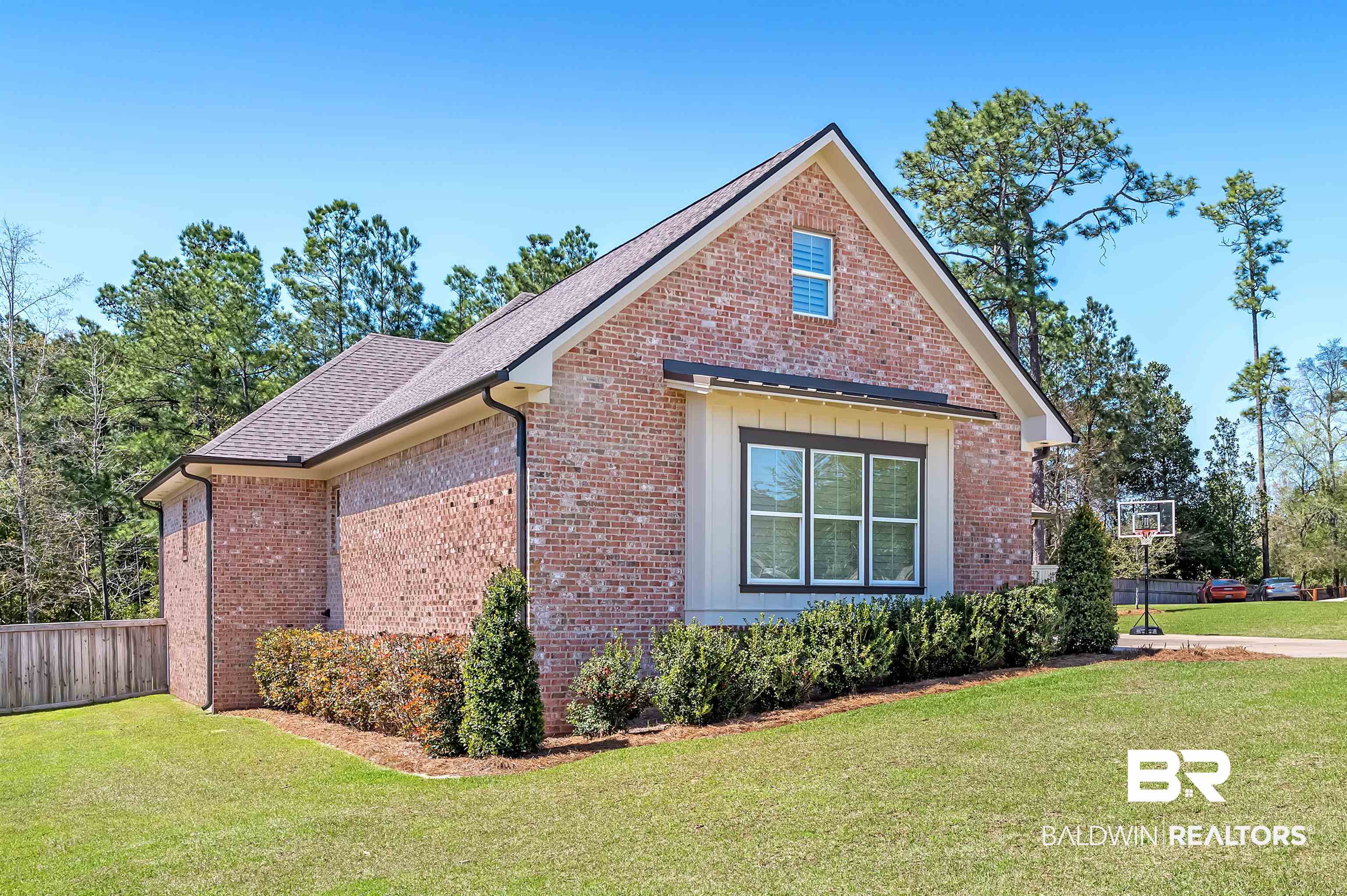 27888 Oakachoy Loop Daphne, AL 36526 - Photo 55 of 65 View of side of property with brick siding, a shingled roof, fence, and a yard